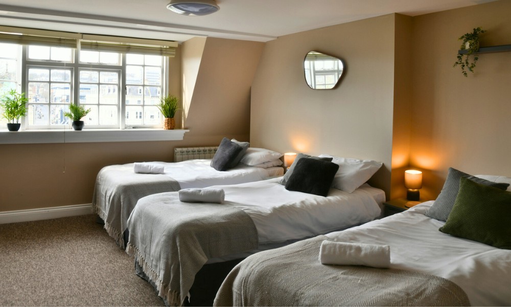 Homely bedroom on the sixth floor with six single beds and en-suite bathroom